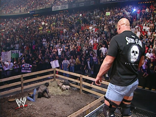 Steve Austin throws Eric Bischoff in to a Pig Pen - WWE Bad Blood 2003